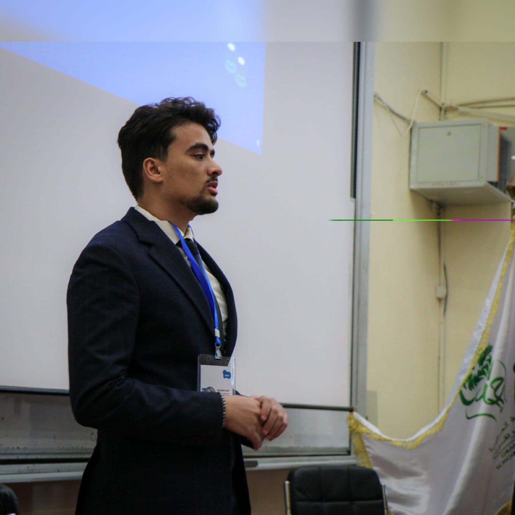 Lotfi Bendiaf presenting during an academic event.