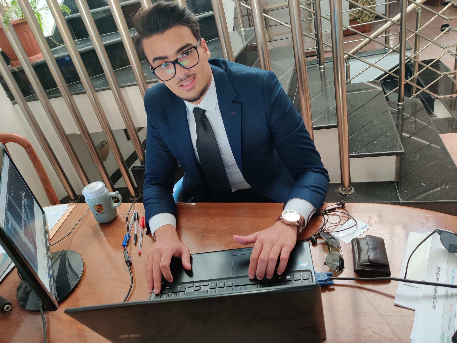 Lotfi Bendiaf working at a desk.